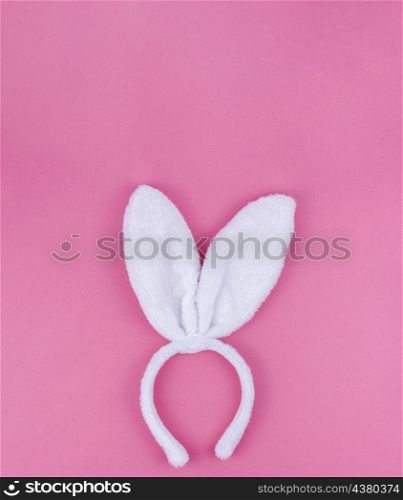 white bunny ears pink background