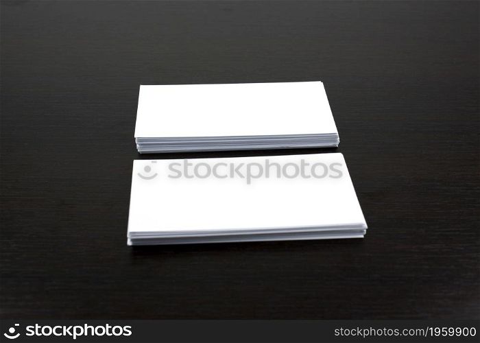 White business cards on wooden surface ideal for mockup