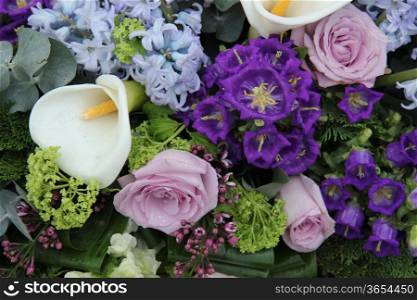 White calla lily in a blue and purple wedding arrangement