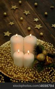White candles on a rustic wooden background