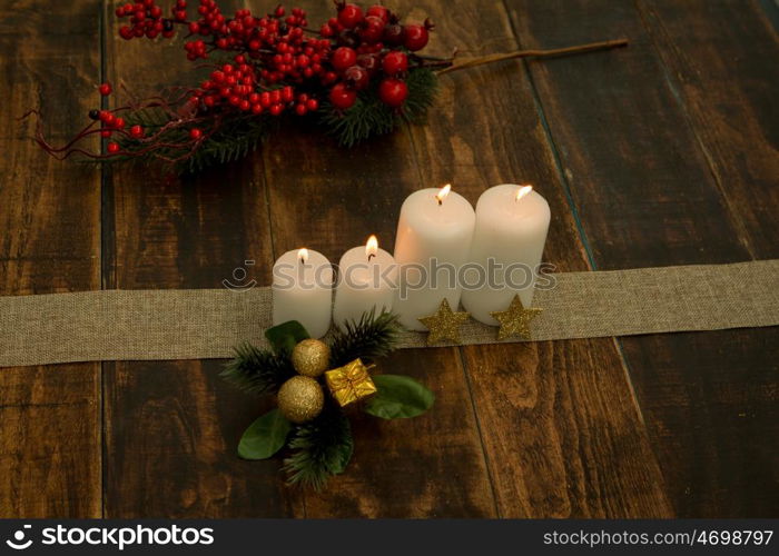 White candles on a rustic wooden background