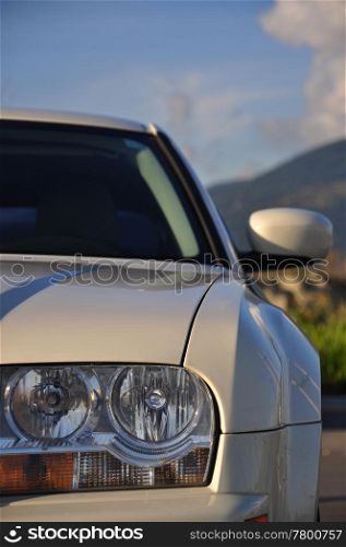 White car front side with nature view