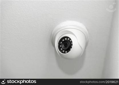 White ceiling mounted security camera with night vision