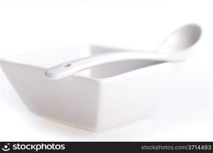 White ceramic bowl and spoon on table