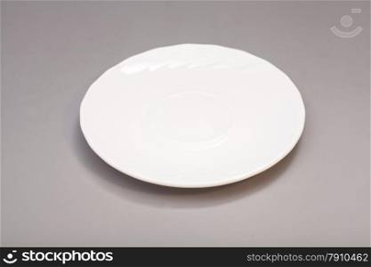 White ceramic plate on gray background