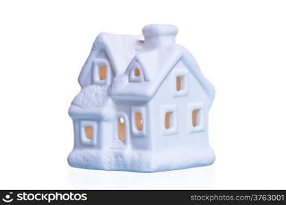 white ceramic souvenir house with glowing windows