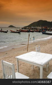 White Chairs on the Beach in Thailand.