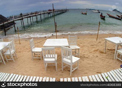 White Chairs on the Beach in Thailand.