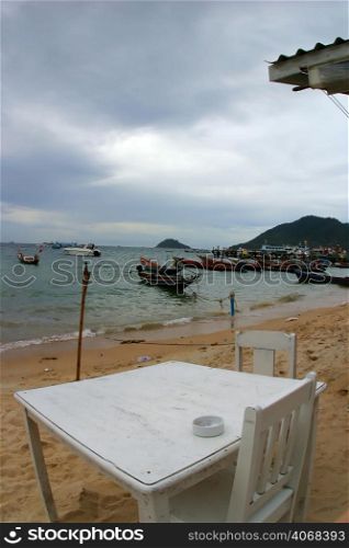 White Chairs on the Beach in Thailand.
