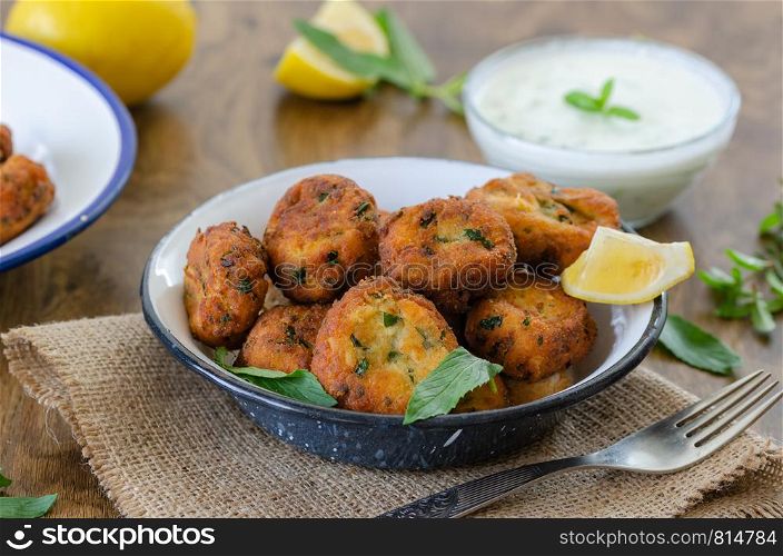 White cheese and yoghurt with courgettes ball , seasonal flavors, vegetable meatballs on the table.