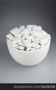 White chewing gum in a white bowl