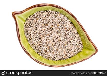 white chia seeds (Salvia Hispanica) in a ceramic leaf shaped bowl isolated on white, top view