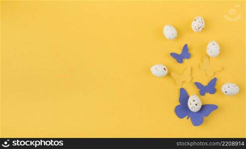 white chicken eggs with paper butterflies