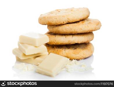 White chocolate biscuit cookies with chocolate blocks and curls on white.