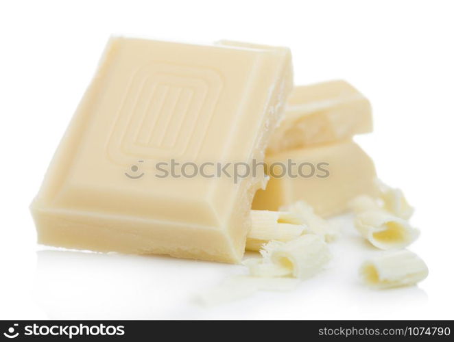 White chocolate pieces and curls isolated on white.