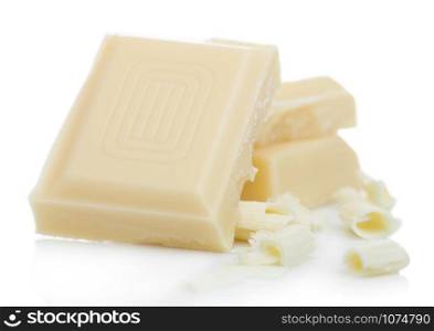 White chocolate pieces and curls isolated on white.