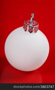 white christmas ball on red background