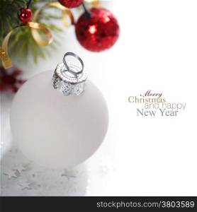 White christmas ball with decorations over white background