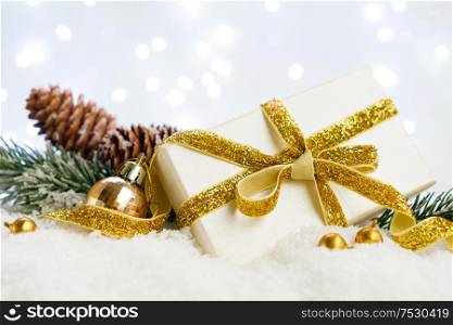 White christmas. gift box with fir tree and decorations in snow. Happy Christas and holidays concept.. White christmas with snow