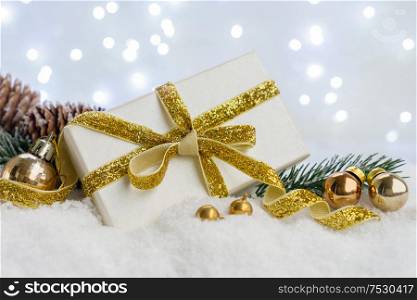 White christmas. gift box with fir tree and decorations in snow. White christmas with snow