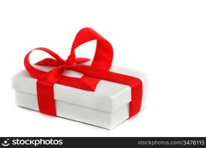 white christmas gift with red heart ribbon