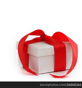white christmas gift with red ribbon