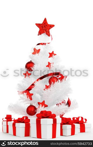 White christmas tree with red decorations and presents isolated on white background