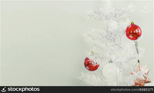White christmas tree with red decorative baubles. Xmas celebration interior design concept.. White christmas tree with red decorative baubles.