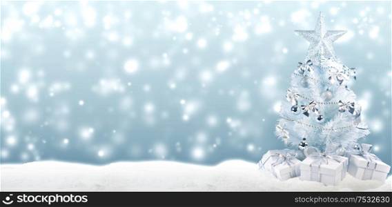 White christmas tree with silver decorations and gifts on snow on bokeh background. Christmas tree and gifts