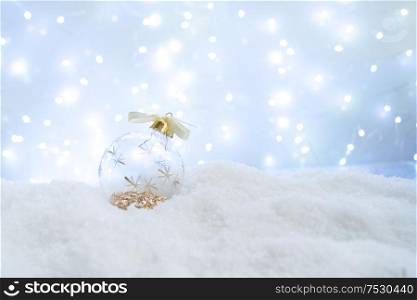 White christmas with snow- glass ball decorations close up. White christmas with snow