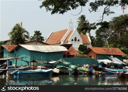 White church and boats in Negombo, Sri Lanka