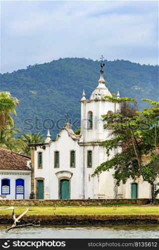 White church near the sea on the south coast of the state of Rio de Janeiro founded in the 17th century. White church near the sea in the ancient and historic city of Paraty