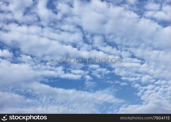 White cirro-cumulus clouds on the blue sky