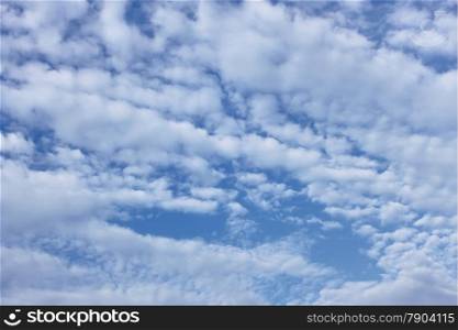White cirro-cumulus clouds on the blue sky