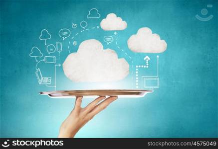 White cloud on tray. Human hand holding metal tray with cloud computing concept