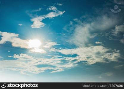 white cloud with sun and blue sky background