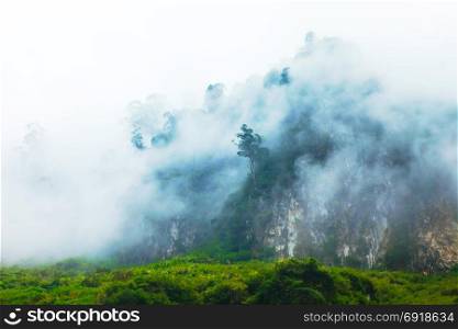 White clouds cover the mountains rocky Global Geopark in Ha Giang, Vietnam