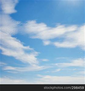 White clouds illuminated by bright sun. Copy space
