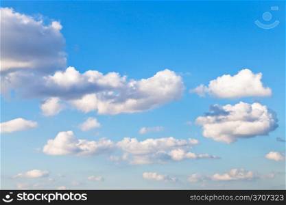 white clouds in blue sky in summer afternoon