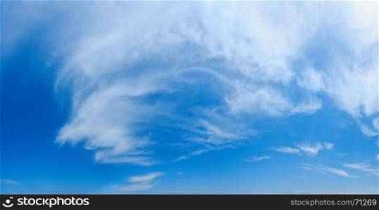 White clouds in the blue azure summer sky. Summer good weather background.