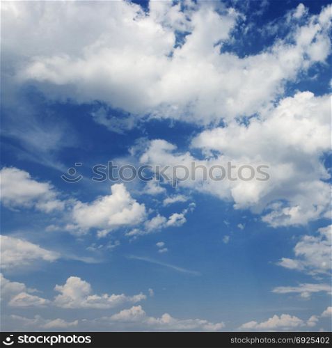 white clouds on a dark blue sky background