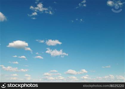 white clouds on blue background