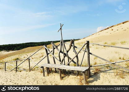 White clouds on blue sky over dunes