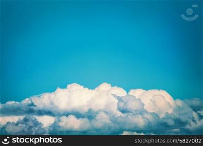 White clouds on the blue sky. Nature background, instagram colorized