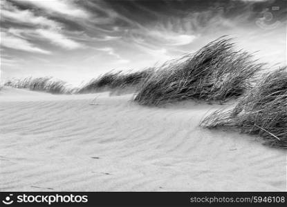White clouds over dunes