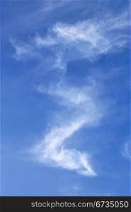 White clouds that resembles a snake against a blue sky