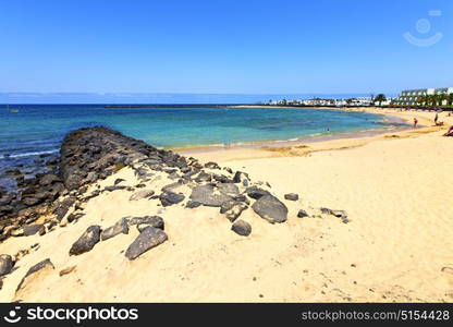 white coast lanzarote in spain beach stone water and summer