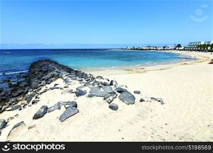 white coast lanzarote in spain beach stone water and summer