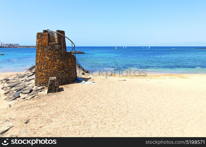 white coast lanzarote in spain beach stone water and summer