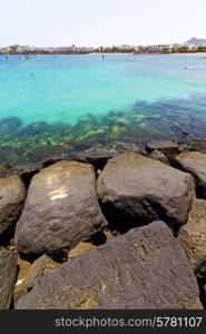 white coast lanzarote in spain beach stone water and summer